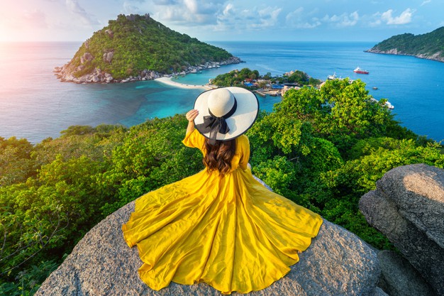 Woman siting on a rock