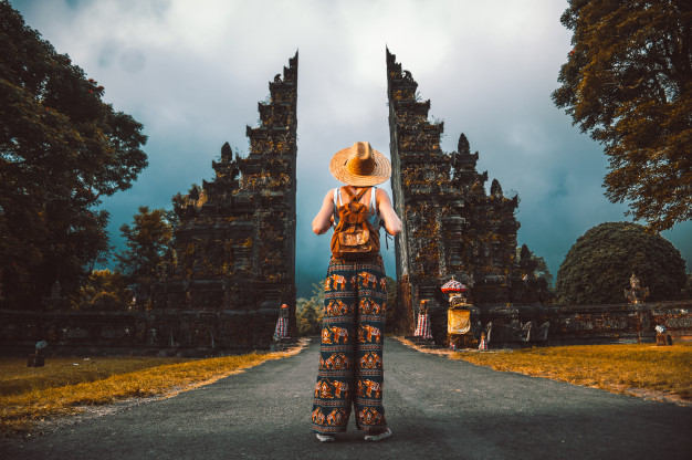 A girl at the enterance of a gate